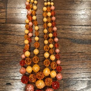 Triple strand orange vintage lucite necklace